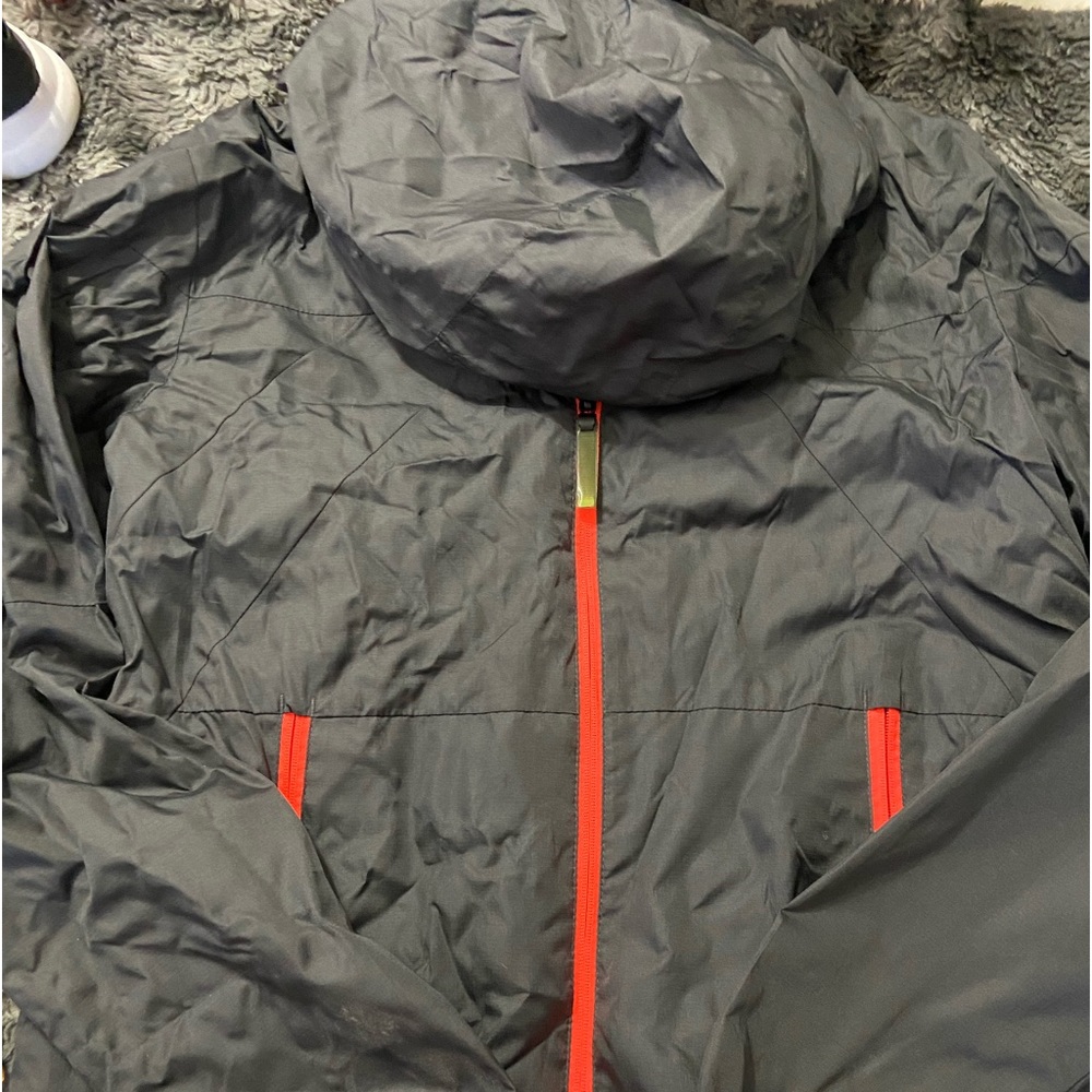 Champion rain jacket. dark grey with safety orange trim. Youth size XL 16-18 EUC